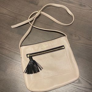 Kate Spade tan cross body - 11” by 10” with gold and black detailing.